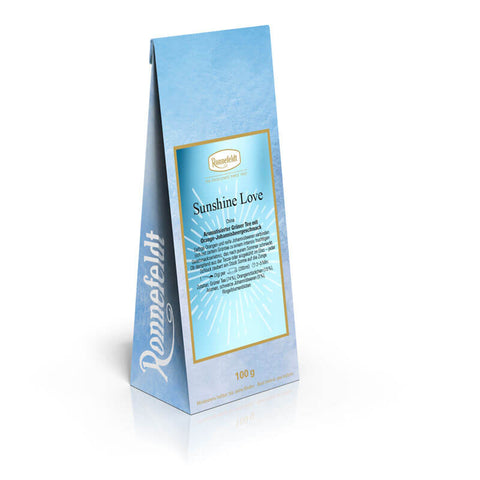 Ronnefeldt Sunshine Love – aromatisierter loser Grüner Tee mit Orangen- und Johannisbeer-Geschmack in der Verpackung